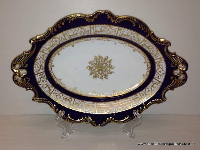 Oggettistica d`epoca → Piatti → Piatto ovale blu cobalto Antico piatto blu cobalto
Elegante piatto in porcellana inglese della fine dell`800 di forma ovale: blu cobalto, traforato e impreziosito da decori in oro nei bordi e nel cavetto. Il fondo misura cm.16x10. Piccoli difetti nei …
... continua ...
Immagine:immagini/catalogo/4000/4246.jpg
